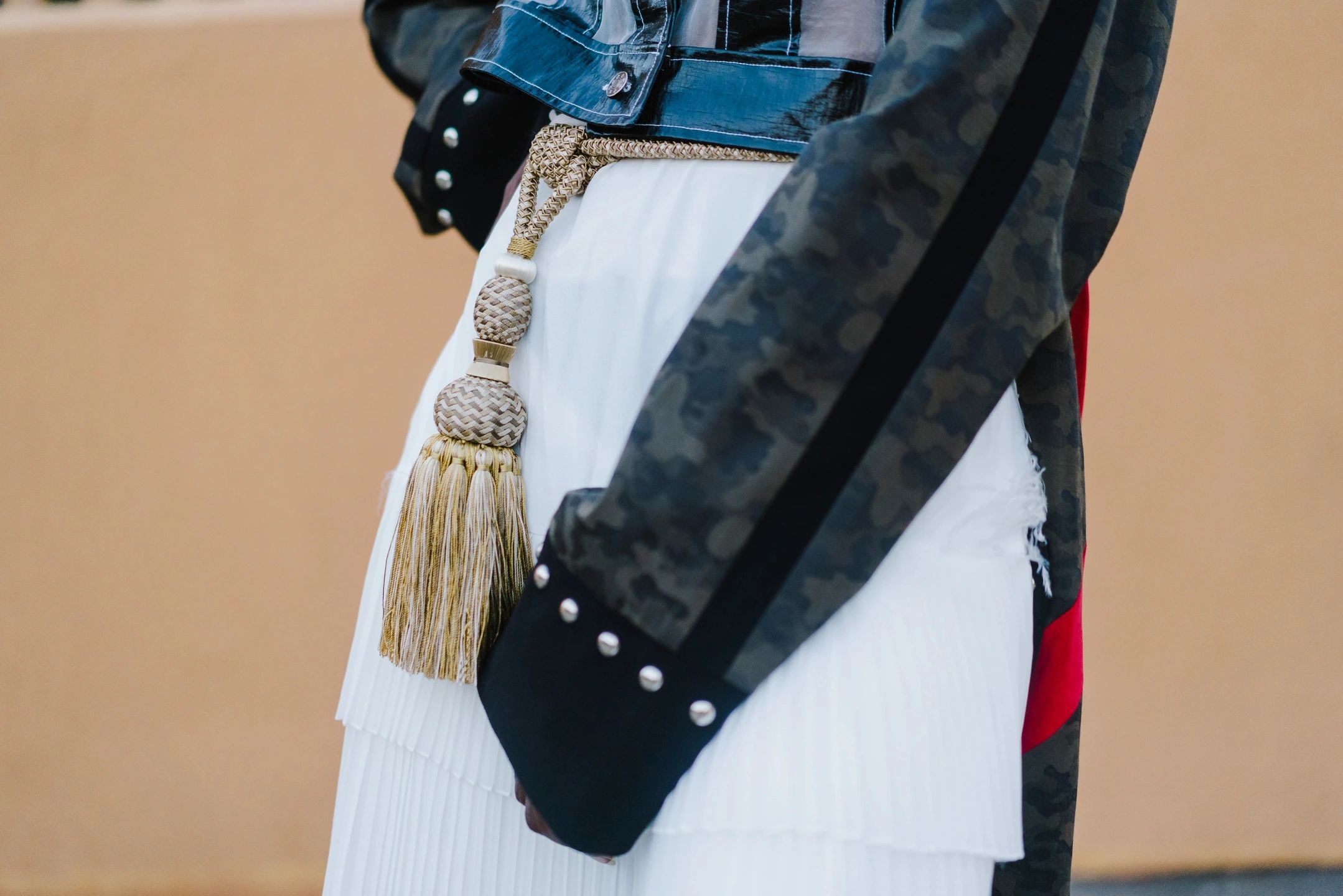 Close-up fashion outfit detail with belt and accessories